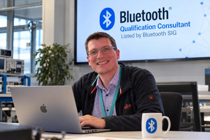 Andreas Bender at IBL-Lab GmbH with a Bluetooth Qualification Consultant presentation in the background