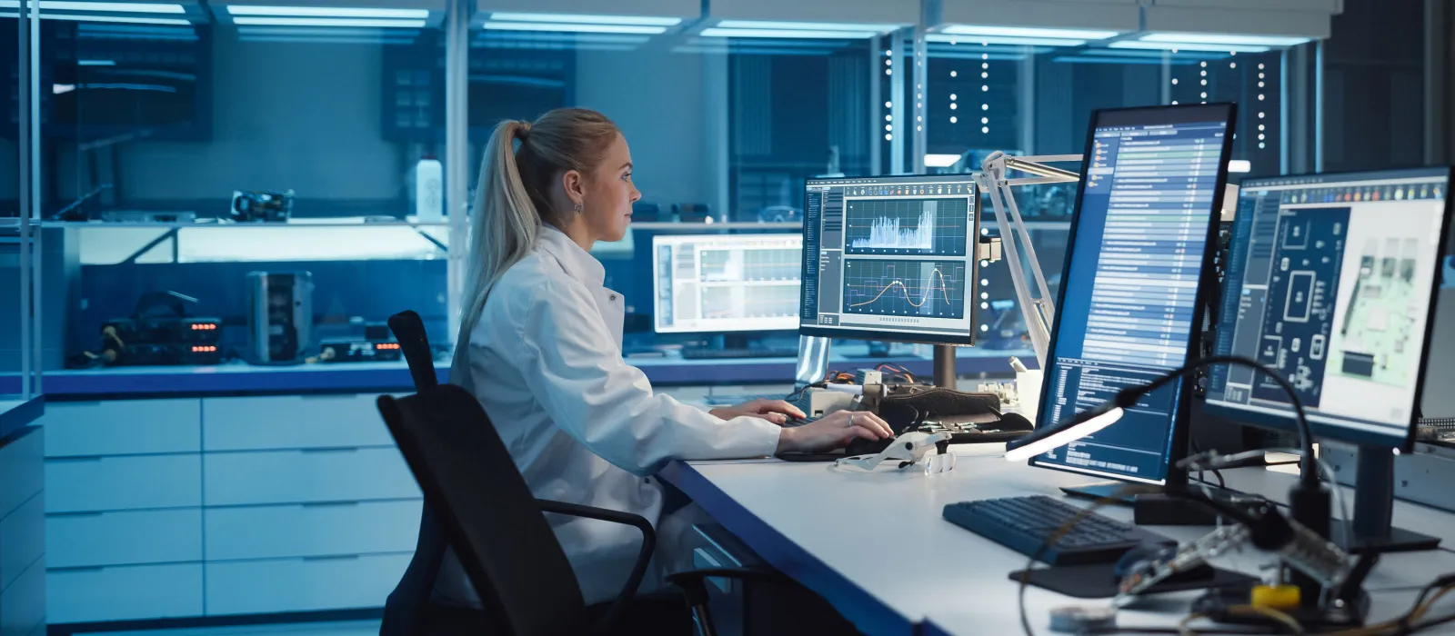 Woman working on a laptop in the test lab