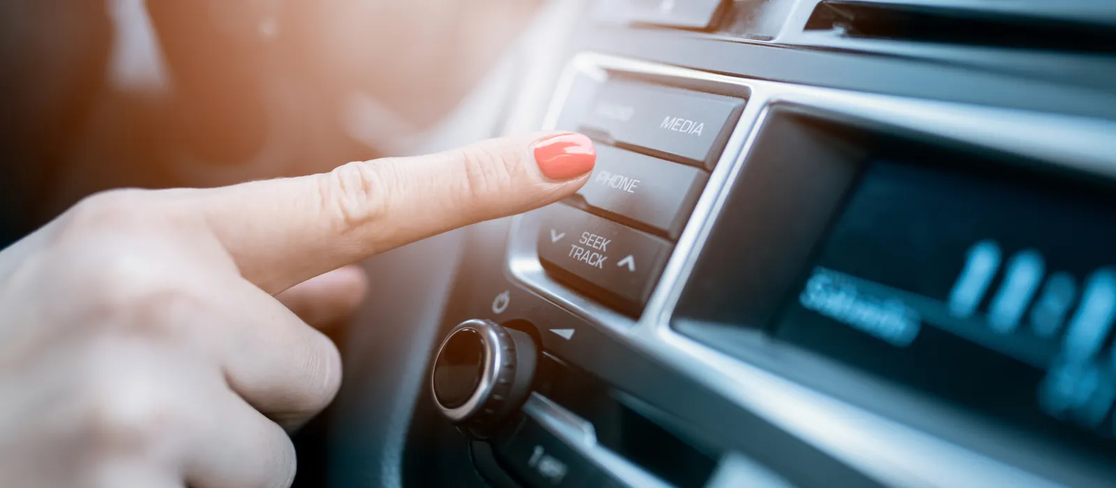 Woman who operates car radio